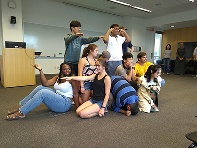 Students participate in an improvisation workshop creativity exercise.