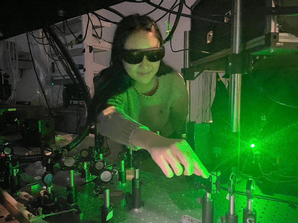 Nuri Hong working with lasers in lab