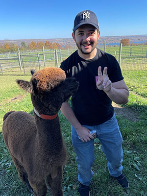 David Bruk-Rodriguez with alpaca friend.