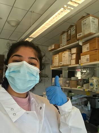 Raina Kikani, masked in the Cosgrove lab 