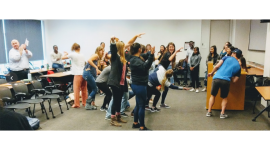 students acting in improv exercise