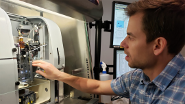 Adam Wojno, director of the Flow Cytometry Facility, sets up samples in a cell sorter.