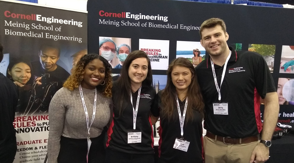 Cornell students at booth at BMES 2019