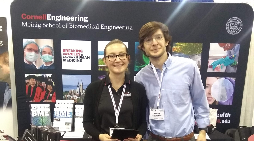 Student standing at booth at BMES 2019