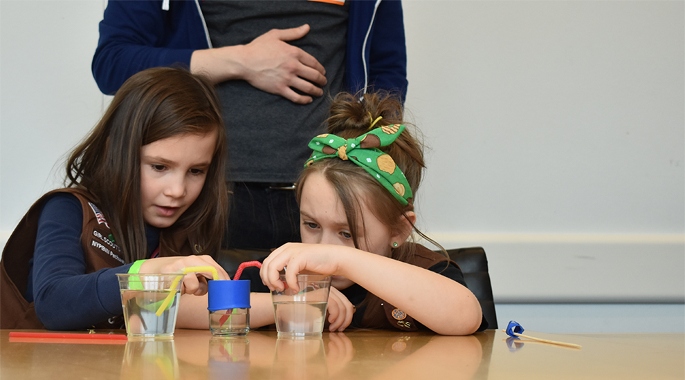 girl scouts working on an experiment